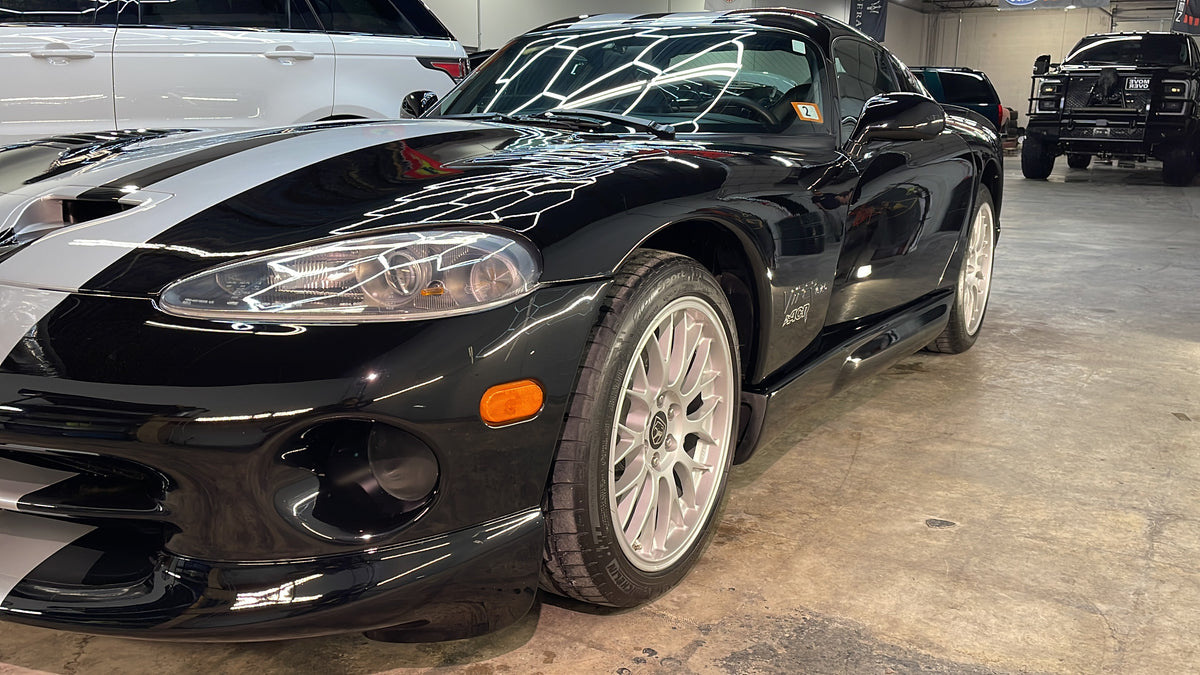 A black Dodge Viper with a deep, glossy finish